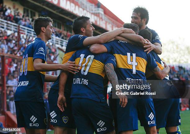 Carlos Tevez of Boca Juniors and teammates celebrate their team's first goal during a match between Argentinos Juniors and Boca Juniors as part of...