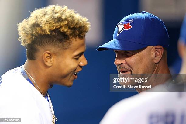 Toronto Blue Jays pitching coach Pete Walker talks with Marcus Stroman after the seventh inning as the Toronto Blue Jays beat the Boston Red Sox 6-1...