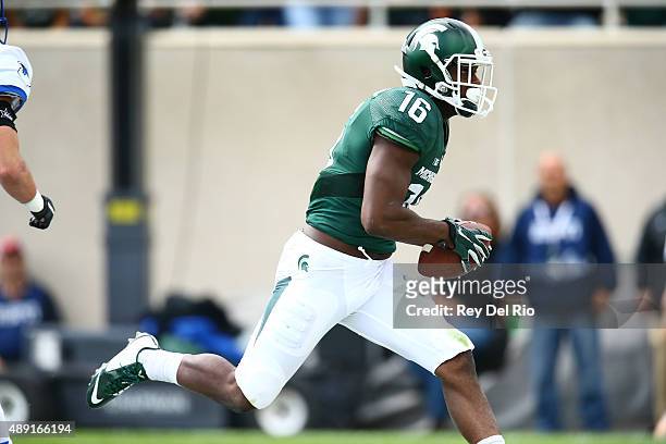 Aaron Burbridge of the Michigan State Spartans makes a catch for a touchdown during the third quarter against the Air Force Falcons at Spartan...
