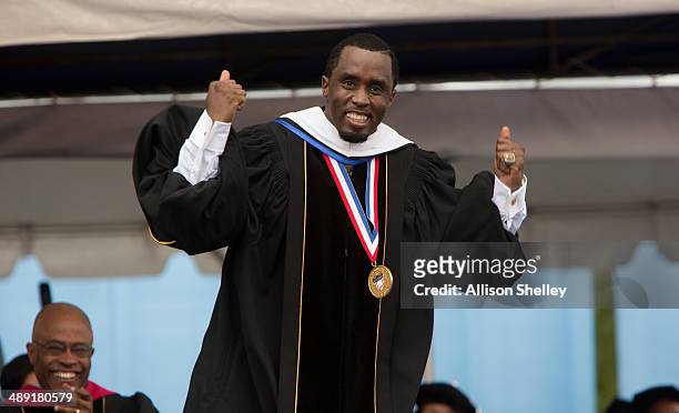 Entrepreneur and philanthropist Sean "Diddy" Combs reacts after delivering the commencement speech at Howard University's 146th commencement...