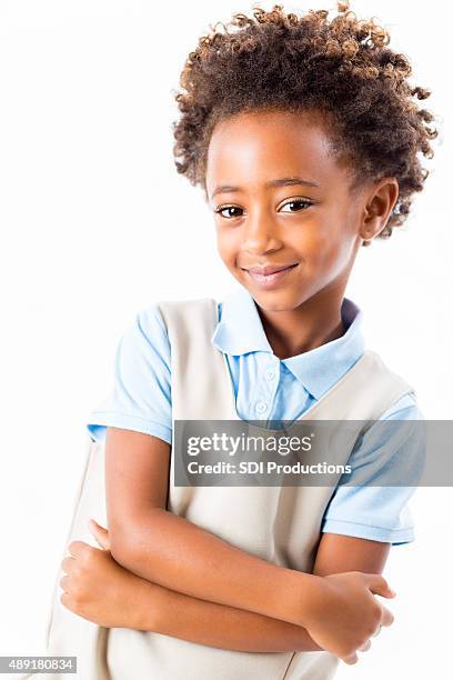 studio shot of african american private elementary schoolgirl in uniform - african american school uniform stock pictures, royalty-free photos & images