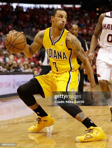 Guard George Hill of the Indiana Pacers dribbles in Game Six of the Eastern Conference Quarterfinals against the Atlanta Hawks during the 2014 NBA...