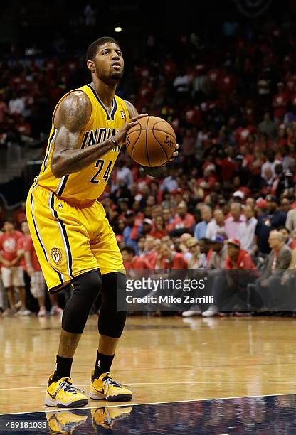 Forward Paul George of the Indiana Pacers attempts a free throw in Game Six of the Eastern Conference Quarterfinals against the Atlanta Hawks during...