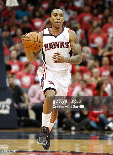 Guard Jeff Teague of the Atlanta Hawks dribbles in Game Six of the Eastern Conference Quarterfinals against the Indiana Pacers during the 2014 NBA...