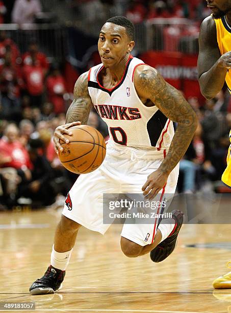 Guard Jeff Teague of the Atlanta Hawks dribbles in Game Six of the Eastern Conference Quarterfinals against the Indiana Pacers during the 2014 NBA...