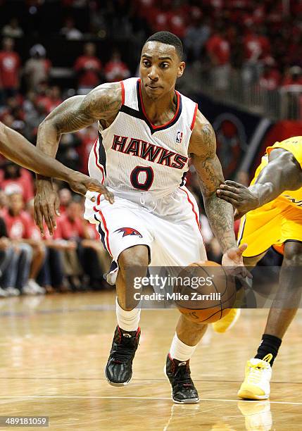 Guard Jeff Teague of the Atlanta Hawks dribbles in Game Six of the Eastern Conference Quarterfinals against the Indiana Pacers during the 2014 NBA...