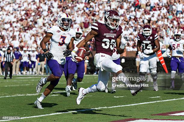 Gabe Myles of the Mississippi State Bulldogs runs the ball in for a touchdown against the Northwestern State Demons at Davis Wade Stadium on...