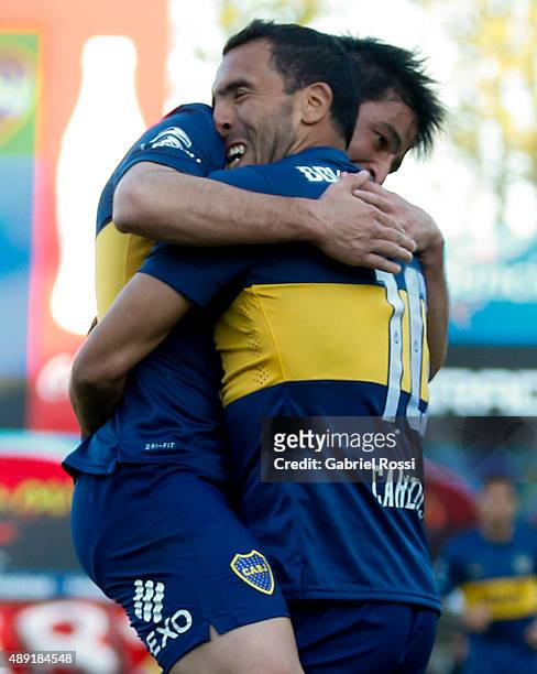 Carlos Tevez of Boca Juniors celebrates with Nicolás Lodeiro after scoring his team's second goal during a match between Argentinos Juniors and Boca...