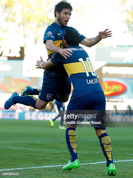 Carlos Tevez of Boca Juniors celebrates with Nicolás Lodeiro after scoring his team's second goal during a match between Argentinos Juniors and Boca...