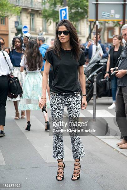 Stylist Barbara Martelo wears vintage Balmain jeans, Ray ban sunglasses and Alaia shoes on day 4 of Paris Fashion Week Haute Couture Autumn/Winter...