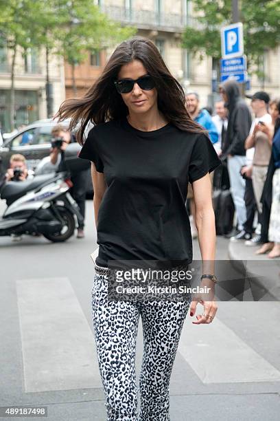 Stylist Barbara Martelo wears vintage Balmain jeans, and Ray ban sunglasses on day 4 of Paris Fashion Week Haute Couture Autumn/Winter 2015 on July...