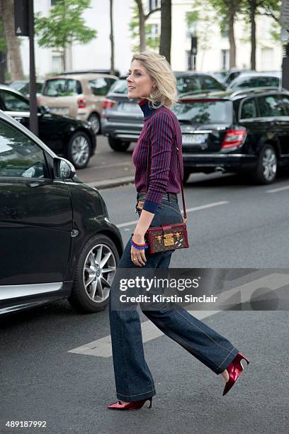 Fashion Blogger Sofie Valkiers wears Louis Vuitton jeans bag and top with Dior shoes on day 4 of Paris Fashion Week Haute Couture Autumn/Winter 2015...