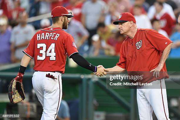 Bryce Harper of the Washington Nationals celebrates a win with manager Matt Williams during a baseball game against the Miami Marlins at Nationals...