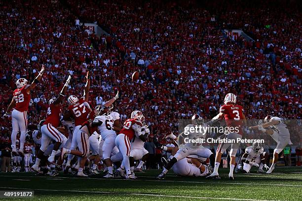 Kicker Ryan Kay of the Troy Trojans attempts an unsuccessful 47 yard field goal against the Wisconsin Badgers during the fourth quarter of the...