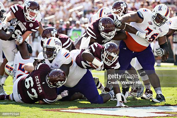 Nick Gibson of the Mississippi State Bulldogs rushes for a touchdown against the Northwestern State Demons at Davis Wade Stadium on September 19,...
