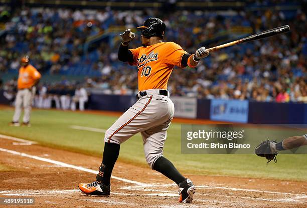 Adam Jones of the Baltimore Orioles hits an RBI single off of pitcher Erasmo Ramirez of the Tampa Bay Rays to score Chris Davis during the sixth...