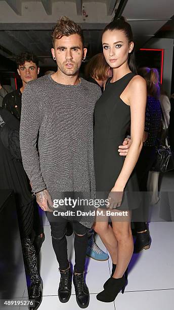 Chris Perceval and Lucy Gascoyne attend the Versus show during London Fashion Week SS16 at Victoria House on September 19, 2015 in London, England.