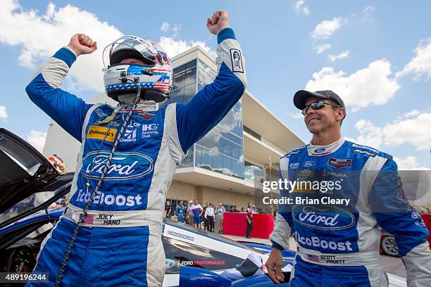 Joey hand, left, and Scott Pruett celebrate in victory lane after winning the IMSA Tudor Series race at Circuit of The Americas on September 19, 2015...