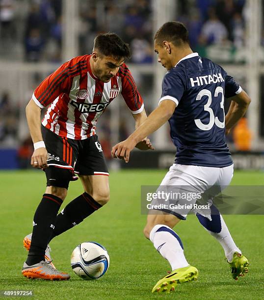 Ezequiel Cerutti of Estudiantes fights for the ball with Nicolas Delgadillo of Velez Sarsfield during a match between Velez Sarsfield and...