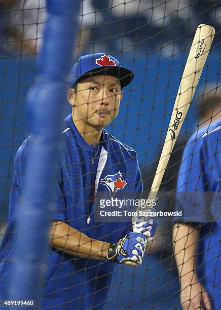 Munenori Kawasaki of the Toronto Blue Jays warms up during batting practice before the start of MLB game action against the Boston Red Sox on...