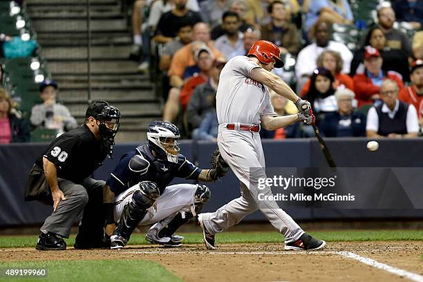 Brennan Boesch of the Cincinnati Reds hits a single in the fifth inning against the Milwaukee Brewers at Miller Park on September 19, 2015 in...