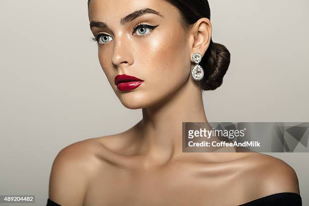 portrait of a nice looking woman - earring stock pictures, royalty-free photos & images