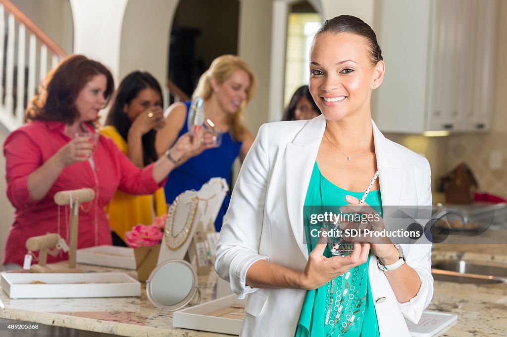 Professional woman attending direct sales home jewelry party