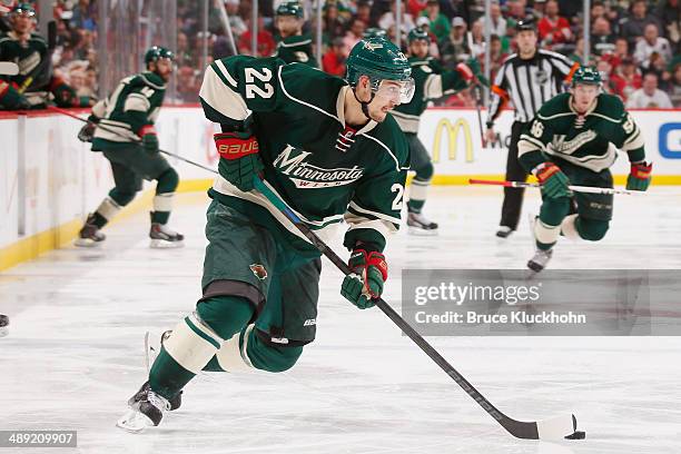 Nino Niederreiter of the Minnesota Wild skates with the puck against the Chicago Blackhawks during Game Three of the Second Round of the 2014 Stanley...