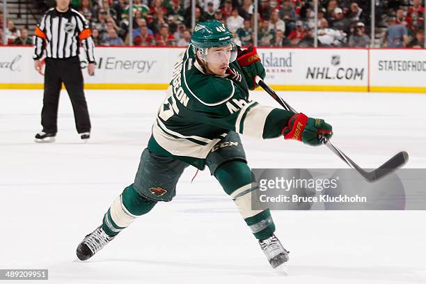 Jared Spurgeon of the Minnesota Wild shoots the puck against the Chicago Blackhawks during Game Three of the Second Round of the 2014 Stanley Cup...
