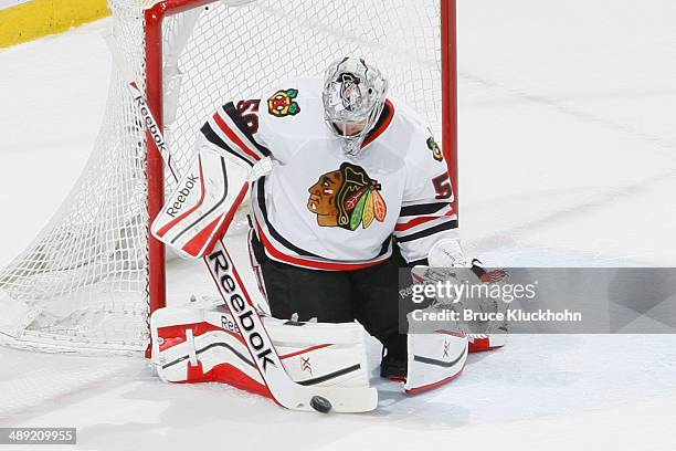 Corey Crawford of the Chicago Blackhawks makes a save against the Minnesota Wild during Game Three of the Second Round of the 2014 Stanley Cup...