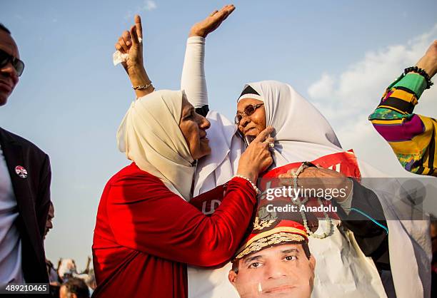 Supporters of the former Egyptian Defence Minister Abdulfattah el-Sisi attend the electoral campaign held in the district of Nasr City before the...