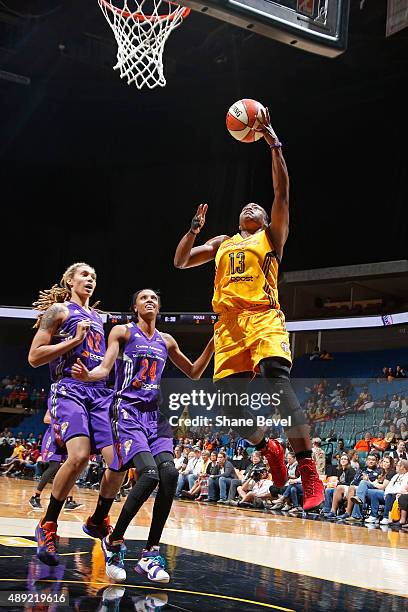 Karima Christmas of the Tulsa Shock drives to the basket against the Phoenix Mercury during Game Two of the WNBA Western Conference Semifinals on...