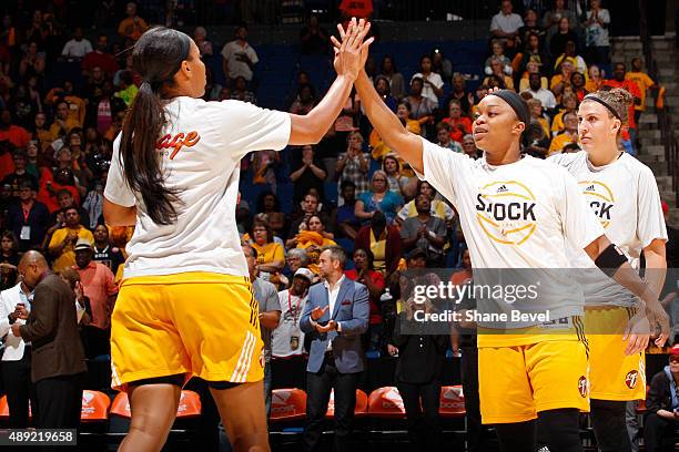 Odyssey Sims of the Tulsa Shock shakes her teammates hands against the Phoenix Mercury before Game Two of the WNBA Western Conference Semifinals on...