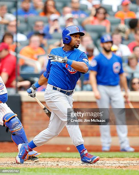 Jonathan Herrera of the Chicago Cubs follows through on a sixth inning two run home run against the New York Mets at Citi Field on July 2, 2015 in...