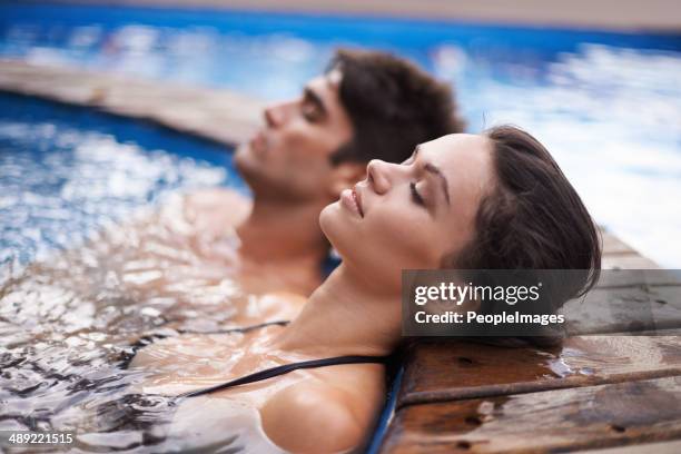 letting their minds drift - hot tub stock pictures, royalty-free photos & images