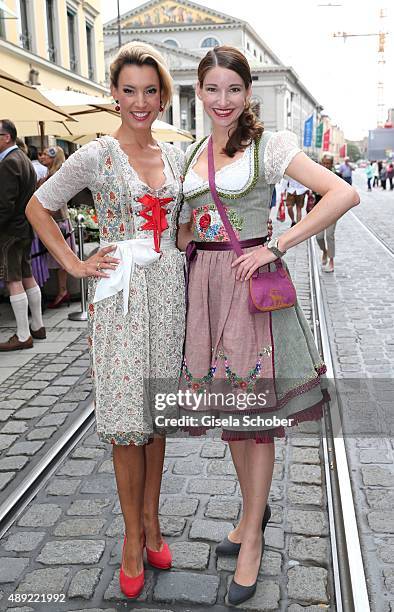 Kim Heinzelmann and Sophie Wepper wearing a dirndl by Lola Paltinger during the 'Fruehstueck bei Tiffany' at Tiffany Store ahead of the Oktoberfest...