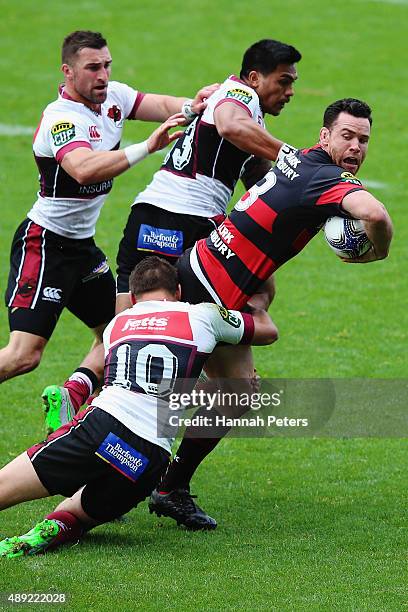 Ryan Crotty of Canterbury looks to offload the ball during the round six ITM Cup match between North Harbour and Canterbury at QBE Stadium on...