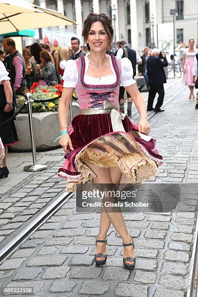 Viktoria Lauterbach wearing a dirndl by Lola Paltinger during the 'Fruehstueck bei Tiffany' at Tiffany Store ahead of the Oktoberfest 2015 on...