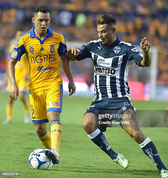 Israel Jimenez of Tigres fights for the ball with Edwin Cardona of Monterrey during a 9th round match between Tigres UANL and Monterrey as part of...