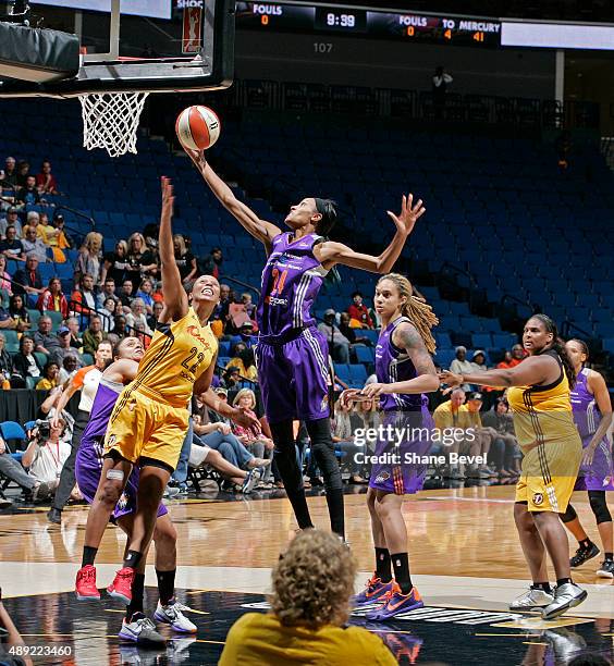 DeWanna Bonner of the Phoenix Mercury grabs a rebound against the Tulsa Shock during Game Two of the WNBA Western Conference Semifinals on September...