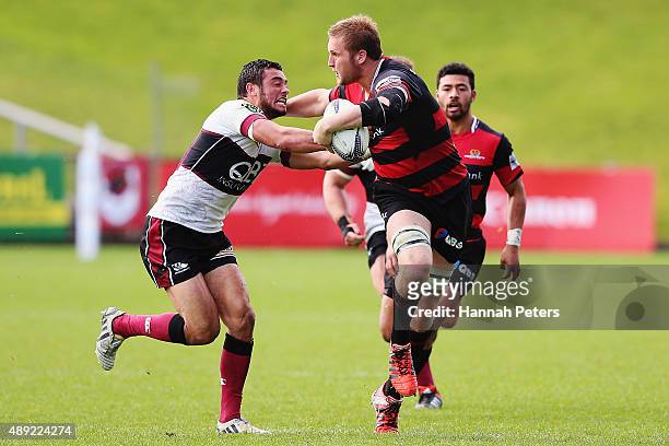 Mitchell Dunshea of Canterbury fends off Bryn Hall of North Harbour during the round six ITM Cup match between North Harbour and Canterbury at QBE...