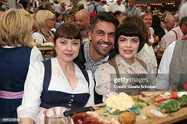 Sister Monique Mathieu, Designer Daniel Fendler and Mireille Mathieu during the Oktoberfest 2015 Opening at Schottenhamel beer tent at Theresienwiese...