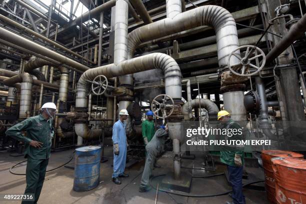Workers rehabilitate the new Port Harcourt refinery built in 1989 at the same site where the first refinery in Nigeria was built in 1965 in oil rich...