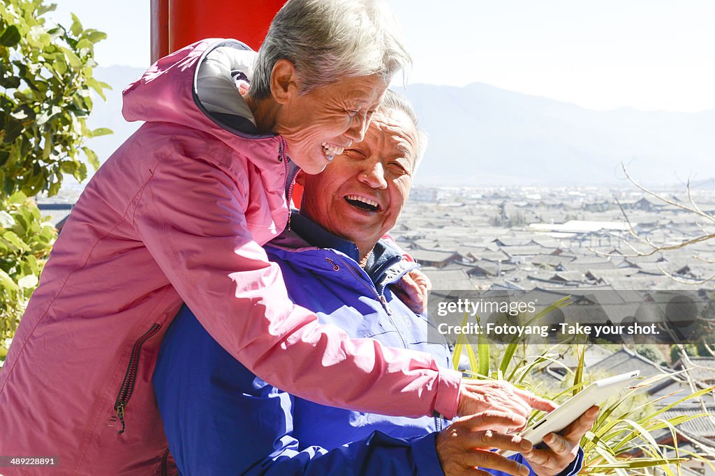 Senior couple using tablet