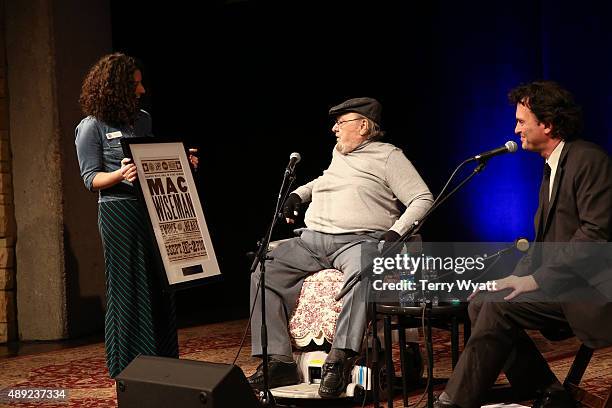 Mac Wiseman is presented with a Hatch Show Print during the Mac Wiseman Program at Country Music Hall of Fame and Museum on September 19, 2015 in...