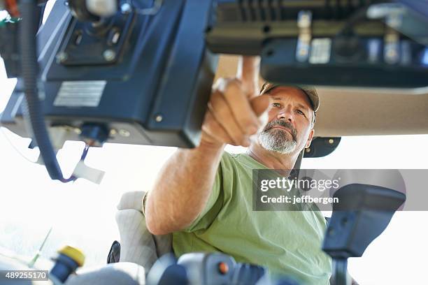 the beginning of the farming day - trekker stockfoto's en -beelden