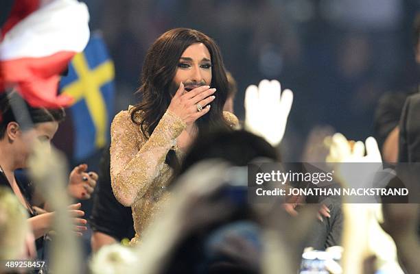 Conchita Wurst representing Austria reacts during the voting ceremony of the Eurovision Song Contest 2014 Grand Final in Copenhagen, Denmark, on May...