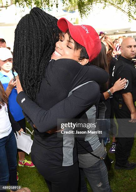 Singer Brandy and actress Halle Berry attends the 21st Annual EIF Revlon Run Walk For Women on May 10, 2014 in Los Angeles, California.
