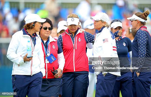 Alison Lee of the United States is comforted by Juli Inkster the United States Team Captain , Nancy Lopez and Wendy Ward United States assistant...