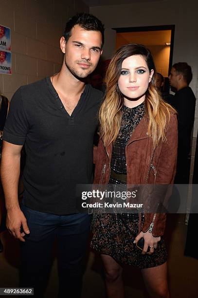 Taylor Lautner and Sydney Sierota attend the 2015 iHeartRadio Music Festival at MGM Grand Garden Arena on September 19, 2015 in Las Vegas, Nevada.